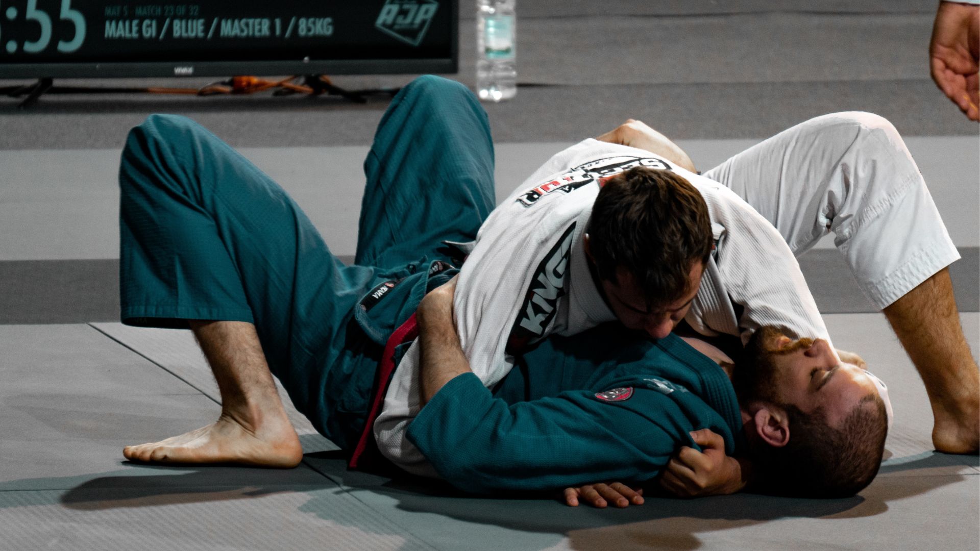 Two men competing in a Brazilian Jiu Jitsu competition
