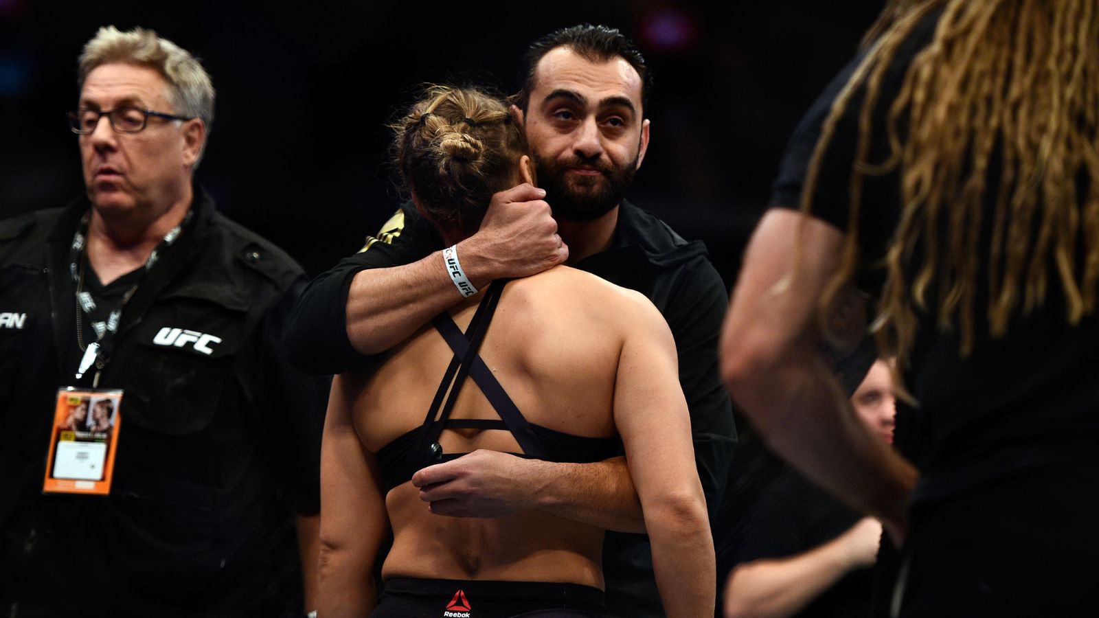 Edmond Tarverdyan hugging Ronda Rousey in the UFC cage